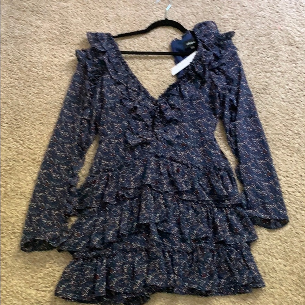 Brand new midi dress. Ruffle neck line and bottom.